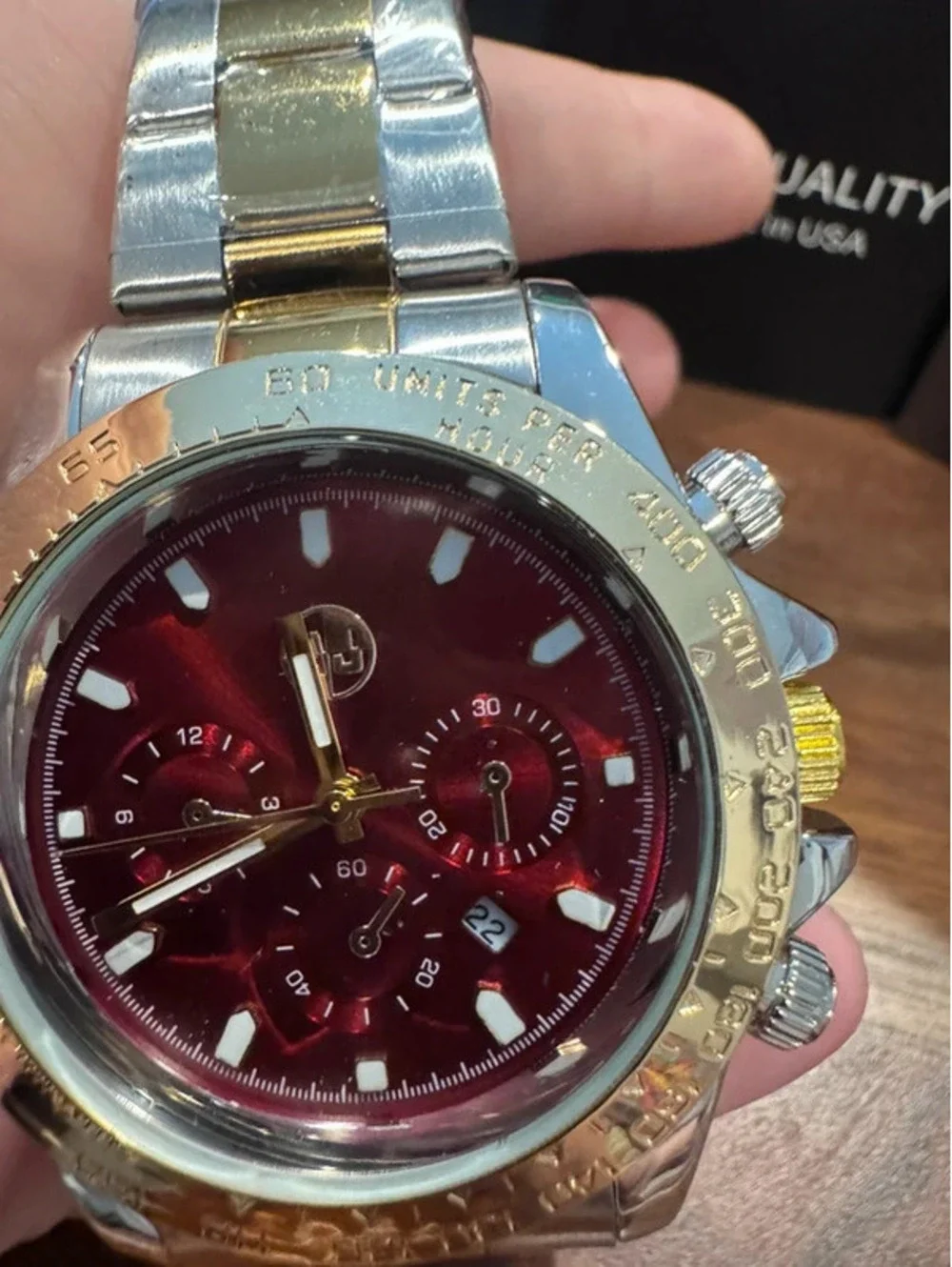 AJ watch, stainless steel, gold & silver toned, crimson red face